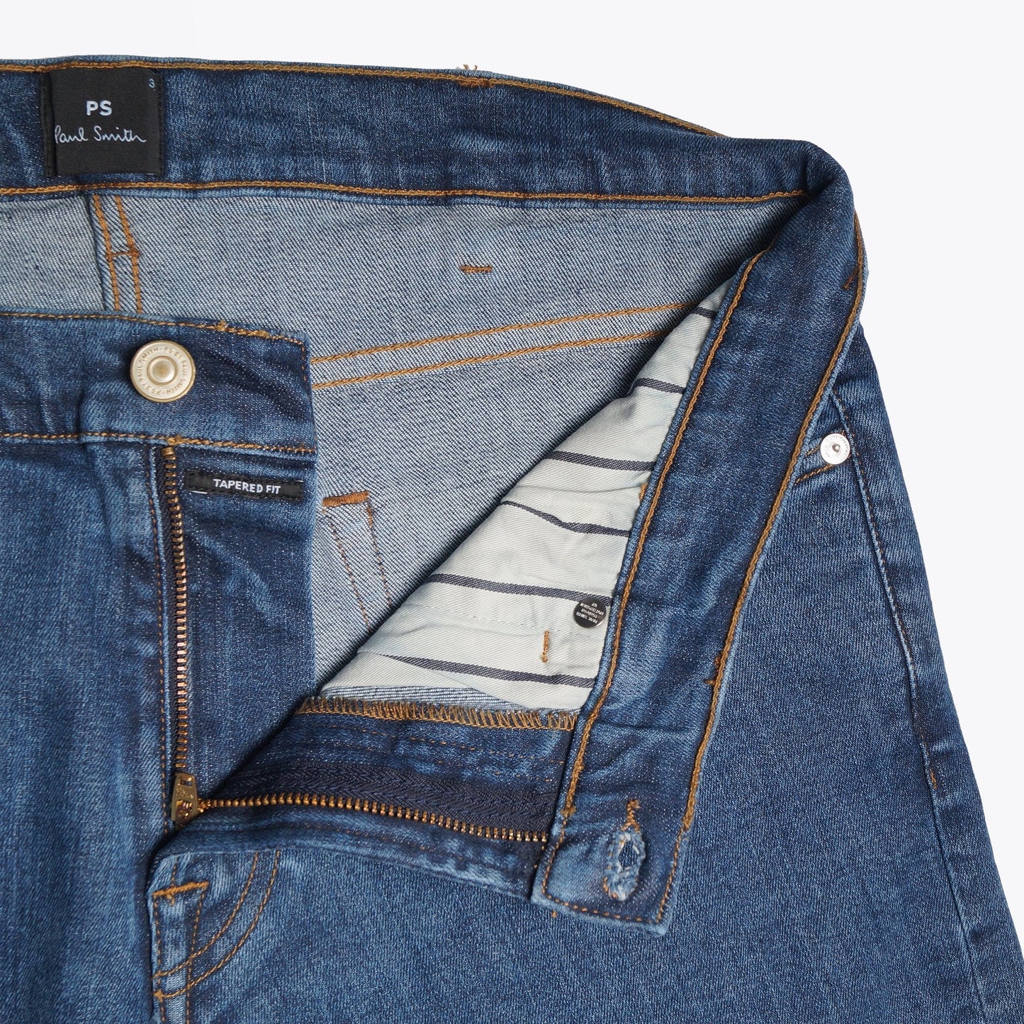 - Reflex Stretch Tapered Jeans - Mid Wash Denim