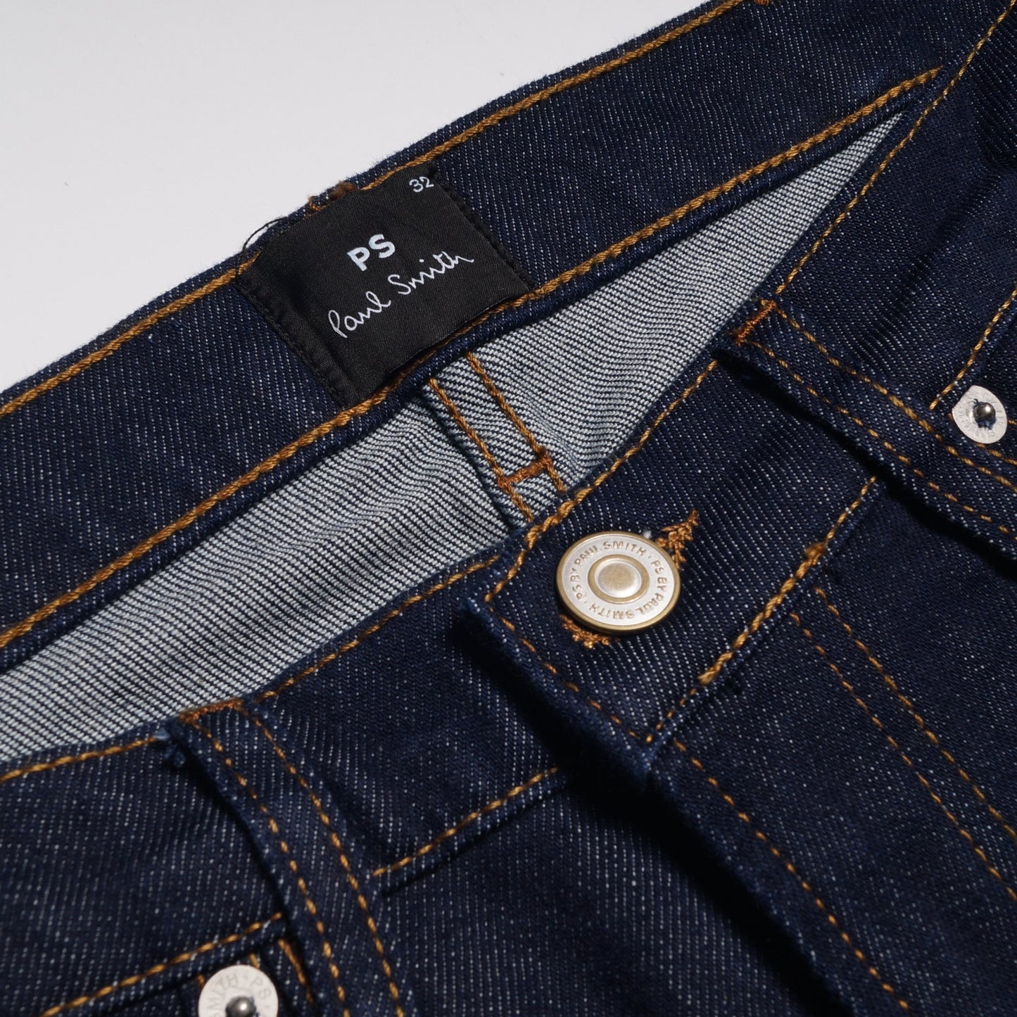 - Tapered Cotton Reflex Jeans - Indigo