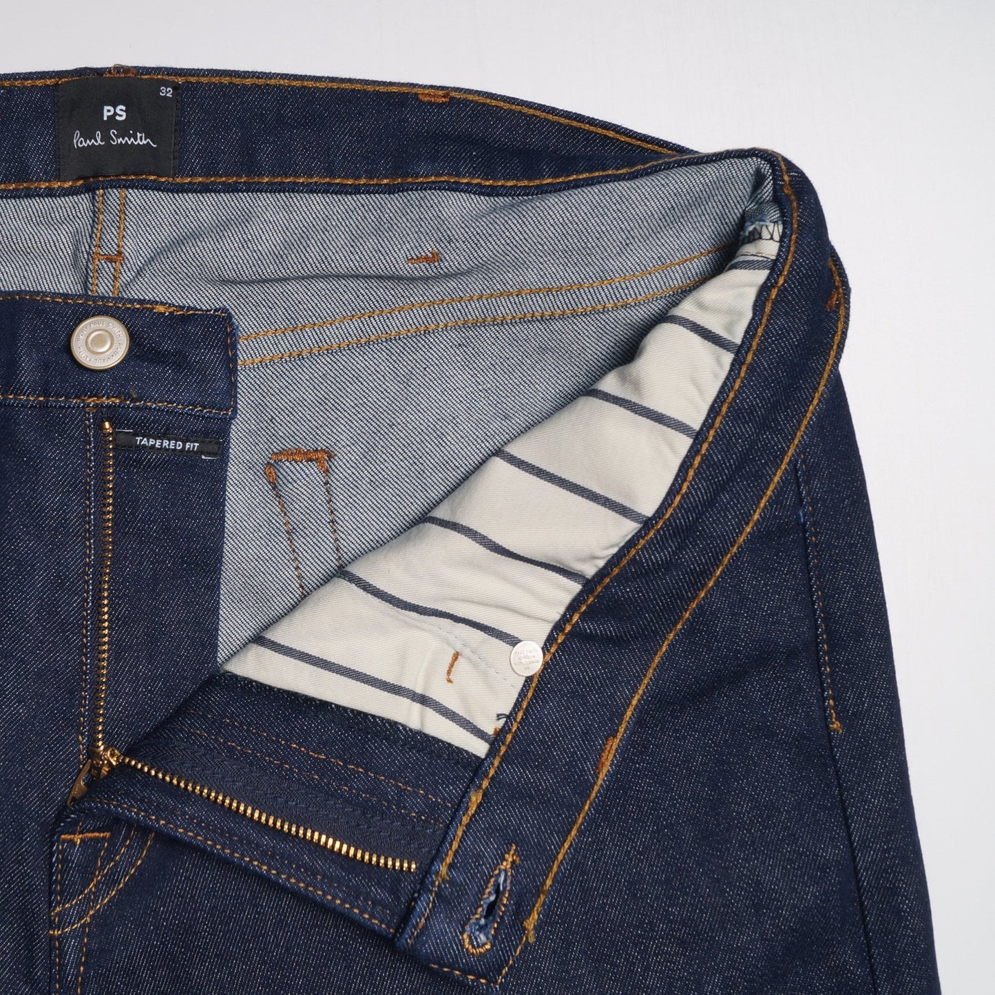 - Tapered Cotton Reflex Jeans - Indigo