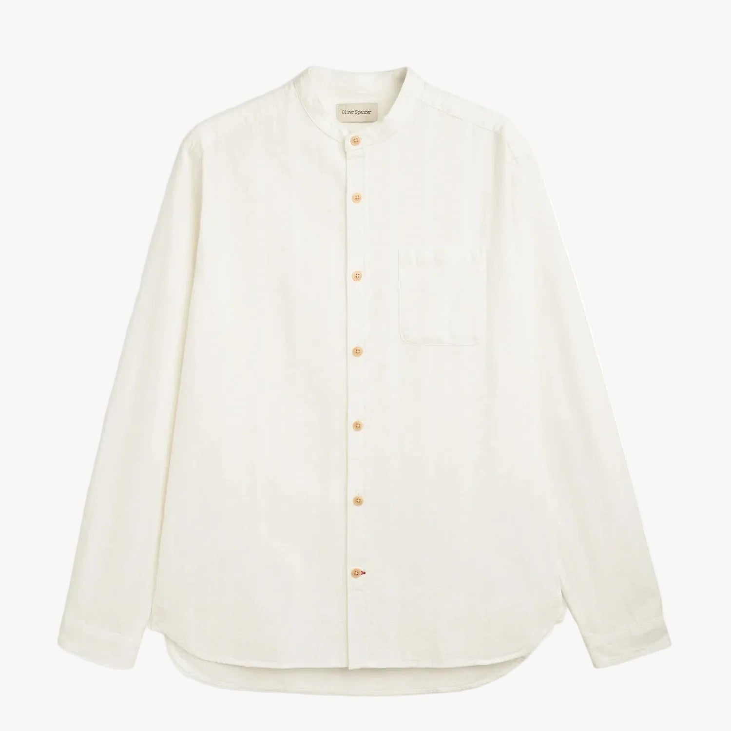 White shirt with orange buttons on a white background